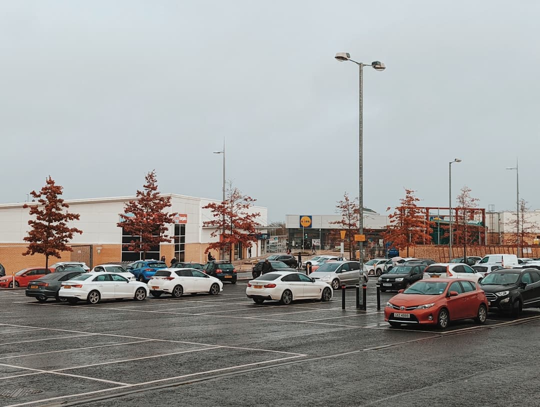 a parking lot filled with lots of parked cars — Photo by Nick Nice on Unsplash
