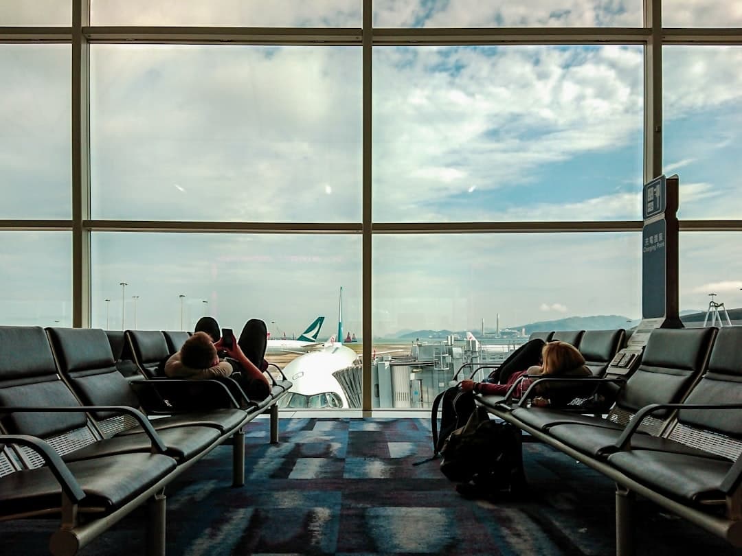 two persons lying on gang chair — Photo by Lai Man Nung on Unsplash