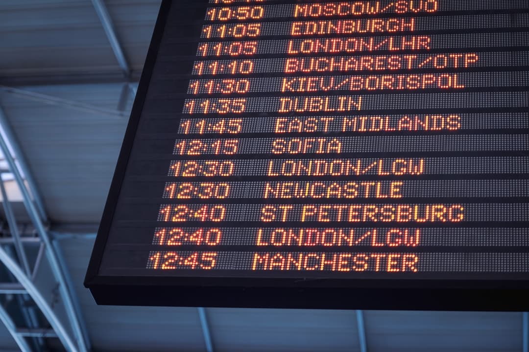 A low-angle shot of a departure board at an airport — Photo by JESHOOTS.COM on Unsplash