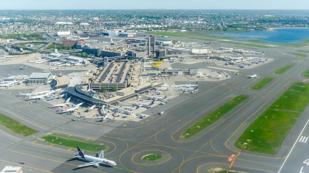 Boston Logan International Airport aerial view showing terminals parking garages runways and aircraft 2025